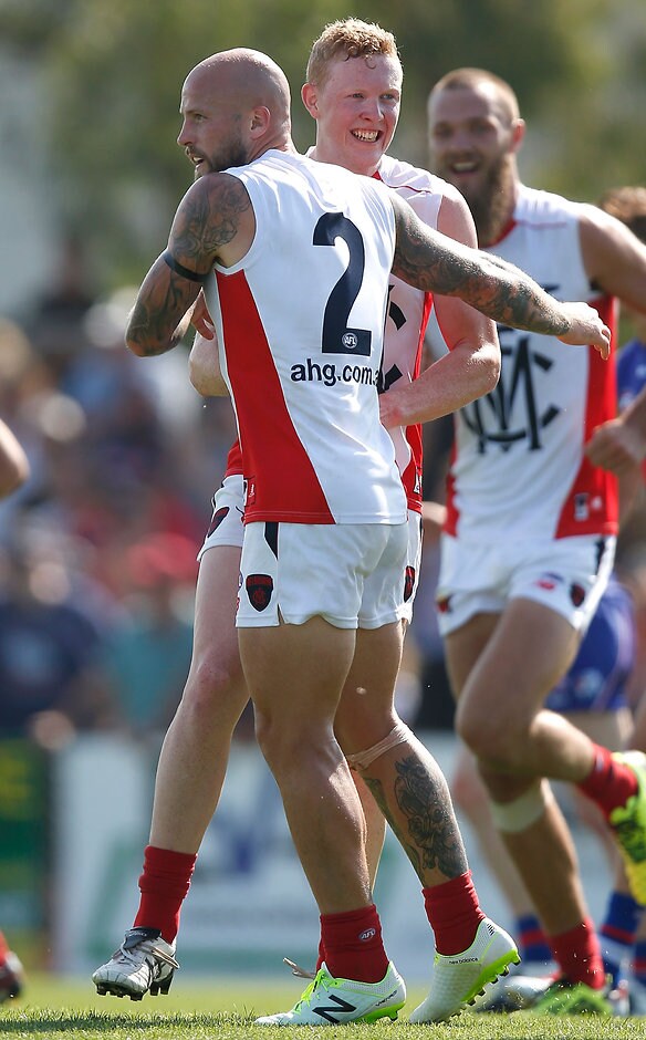 AFL 2016 NAB Challenge - Western Bulldogs v Melbourne Skipper Nathan Jones embraces Clayton Oliver on Sunday - ${keywords}